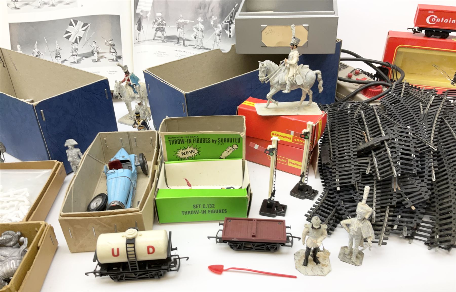Fifty modern lead figures of mounted and foot soldiers, various period uniforms from 18th century to WW2, painted and unfinished with related paperwork; small quantity of Hornby '00' gauge model railway items and track; and four boxed Subbuteo teams etc
