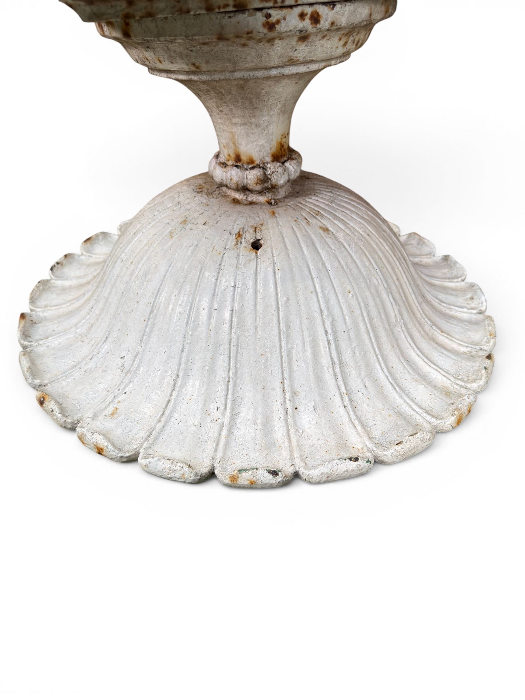 Coalbrookdale - pair of 19th century cast iron petal rim urns, squat form on square plinth, finished in distressed white paint, design registration number 133334, first registered 19 september 1860, number 19 in the Coalbrookdale Castings Catalogue (see illustration)
