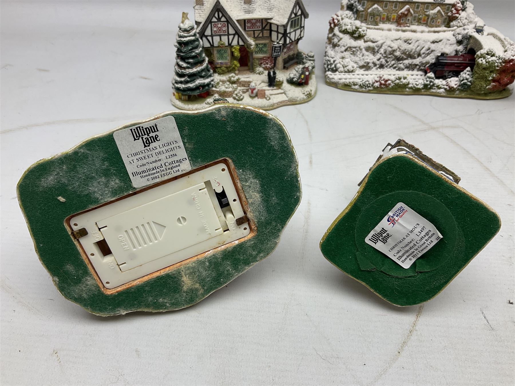 Five Lilliput Lane Illuminated Cottages, comprising Christmas is Coming, with box and deed, Christmas at Mol's, with box and deed, Christmas in Canterbury, with box and deed, Christmas Lights at Sweet Delights and The Three Kings, with box and deeds, together with twelve other Lilliput lanes, to include The First Noel, with box and deed, Winters Moonlight, Yuletide treats, with box and deed etc (17)
