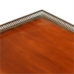 Late Regency mahogany side table in the manner of Gillows, the rectangular top with pierced brass gallery, raised on a reeded column and quatreform base with scroll carved feet with castors 