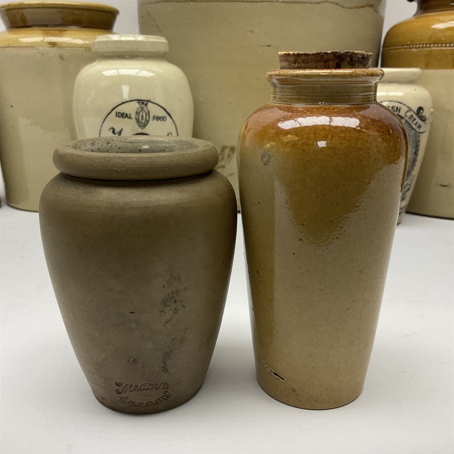 Large 2 gallon stoneware flagon, stamped 'John Soulby Wine Merchant Malton 2 Gall', together with a collection of similar stoneware jars and bottles, largest H40.5cm