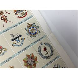 Large poster entitled 'Crests and Badges of the British Army in Daily Use 56 x 86cm; together with twenty-five colour prints of military interest including Crimean War, Boer War, WW2 etc; various sizes; all unframed