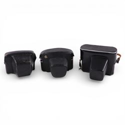 Asahi Pentax Spotmatic 35mm SLR camera, with Super-Takumar 1:1.8/55 lens, Petri Racer rangefinder camera and a Zenit-E camera, all in leather cases