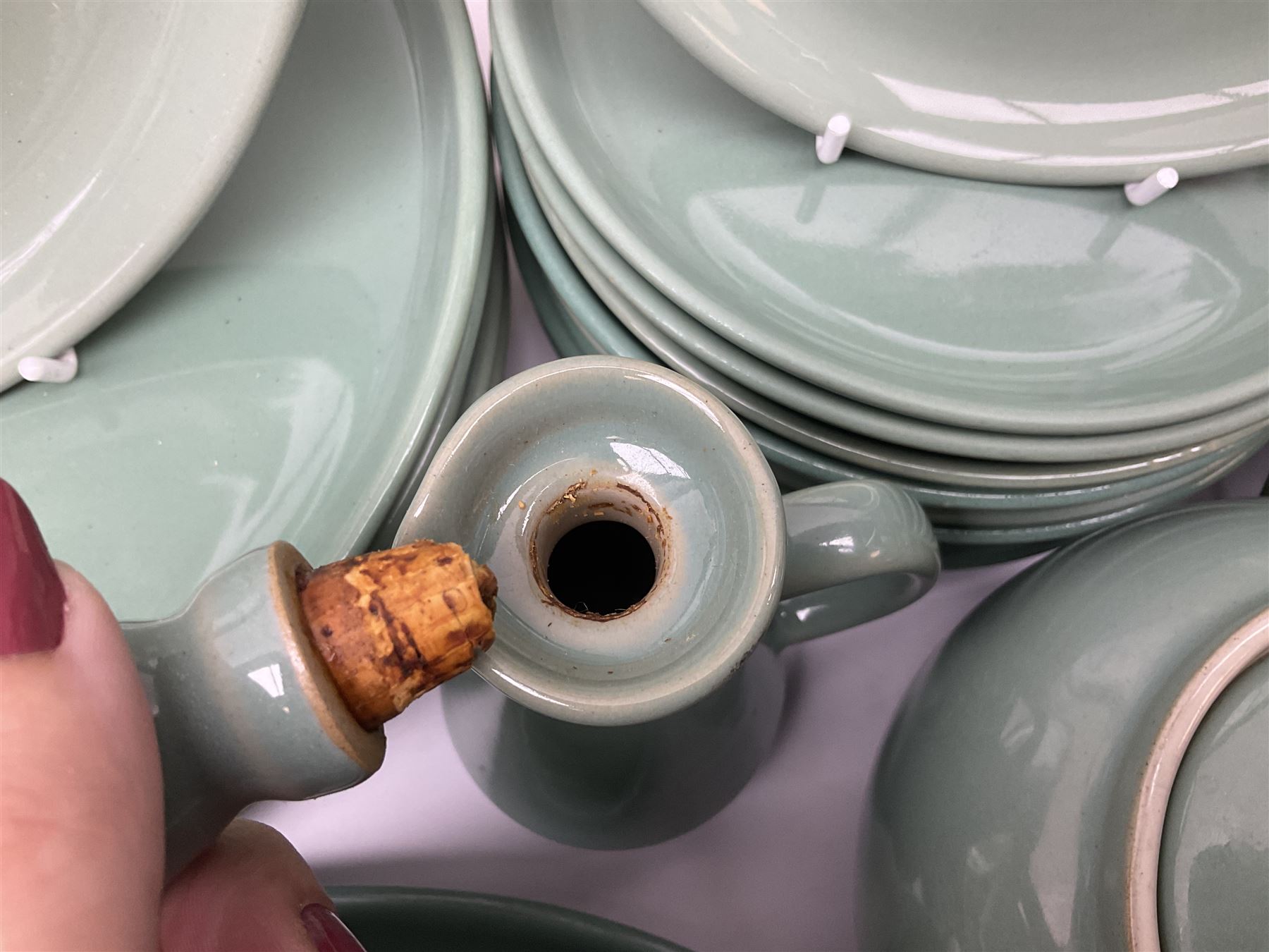 Denby Manor Green pattern part tea and dinner service, to include seven dinner plates, thirteen side plates, ten dessert plates, two oval dishes of various sizes, four cups and saucers, seven bowls with covers, two teapots etc (74)  