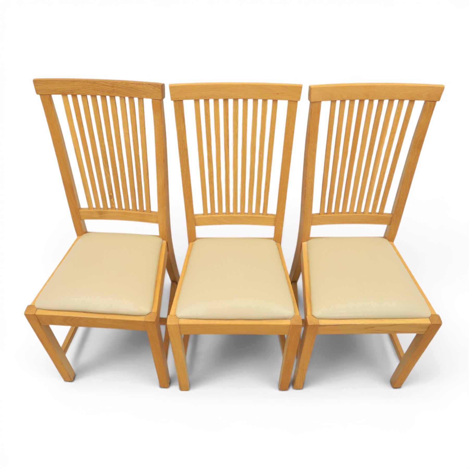 Contemporary oak dining extending table and set of six chairs, with additional leaf  extending to 182cm, chairs with cream upholstered seat