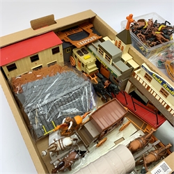 Frontierland play setting with plastic cowboy and Indian figures, totem poles, wig-wams, canoes, various town buildings, covered wagons, stage coaches etc