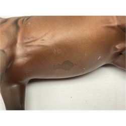 Four Beswick horse figures, comprising Quarter Horse, two Shires no 818 and matt palomino, together with Beswick donkey and Royal Doulton horse on a wooden plinth  