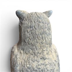 Pair of large composite stone garden statues modelled as standing horned owls, raised on circular bases