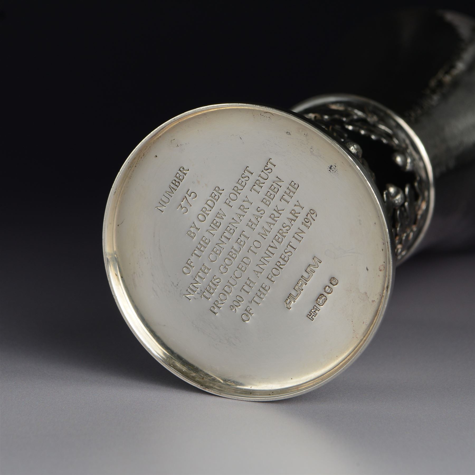 Modern limited edition silver goblet, 'by order of The New Forest of Ninth Centenary Trust this goblet has been produced to mark the 900th anniversary of the Forest in 1979' designed by Hector Miller for Aurum, the fluted planished bowl with gilt interior, upon a stem decorated in relief with oak leaves and acorns revealing a harse and foal to centre, limited edition no. 375, hallmarked Hector Miller, London 1980, H16.5cm, boxed