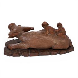 Chinese carved hardwood figural group of two boys climbing on the back of a water buffalo, sitting on a carved and pierced hardwood stand, W30cm; together with a carved reclining figure of a woman and a figure of a tiger (3)