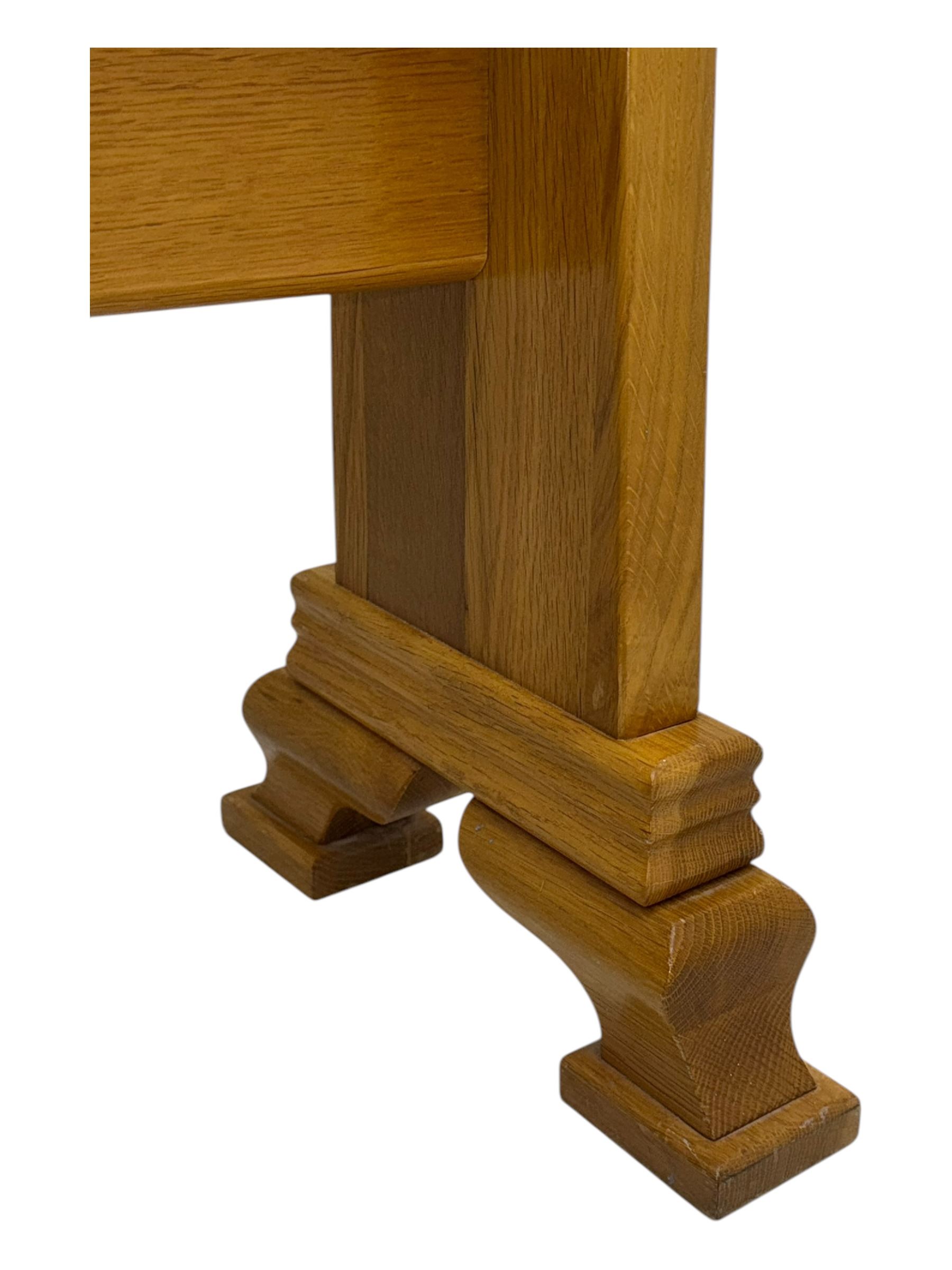 Contemporary light oak cheval dressing mirror, rectangular frame enclosing plain mirror plate, on shaped supports with turned finials, raised on stepped bracket feet
