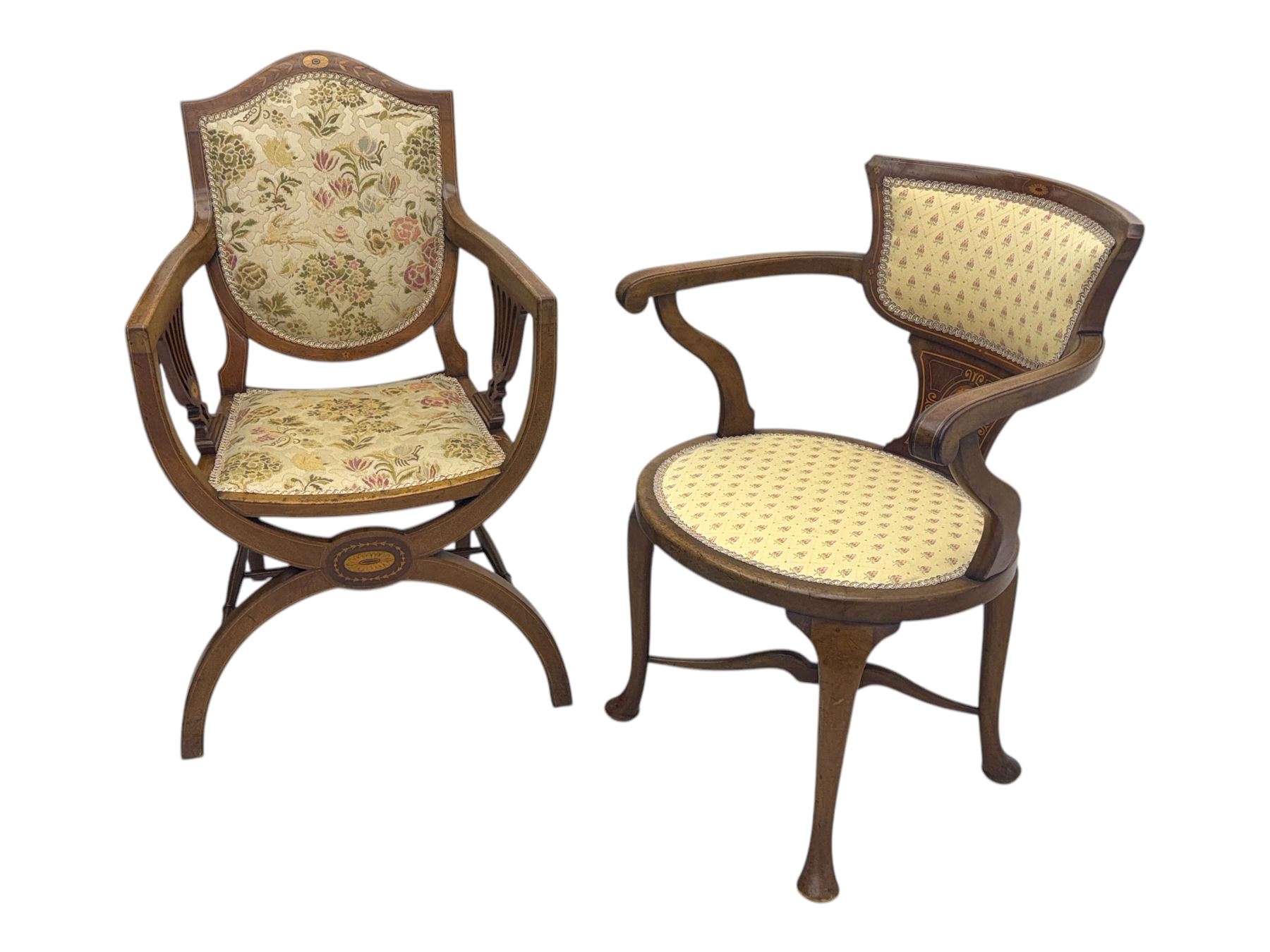 Edwardian inlaid mahogany X-frame armchair, upholstered seat and shield-back, curved front supports united by turned H-stretcher (W57cm, D58cm, H94cm); similar inlaid mahogany armchair, raised on cabriole supports united by cross-stretcher (W62cm, D60cm, H82cm) 