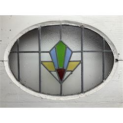 1930s external door with stained leaded glass panel (86cm x 203cm), six small stained glass windows in wooden frames (W52cm); and various loose stained leaded glass panels