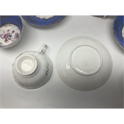 Set of three Victorian teacups and saucers, with matching dessert plate, decorated with a watered silk blue boarder and hand painted floral sprays to the centre 
