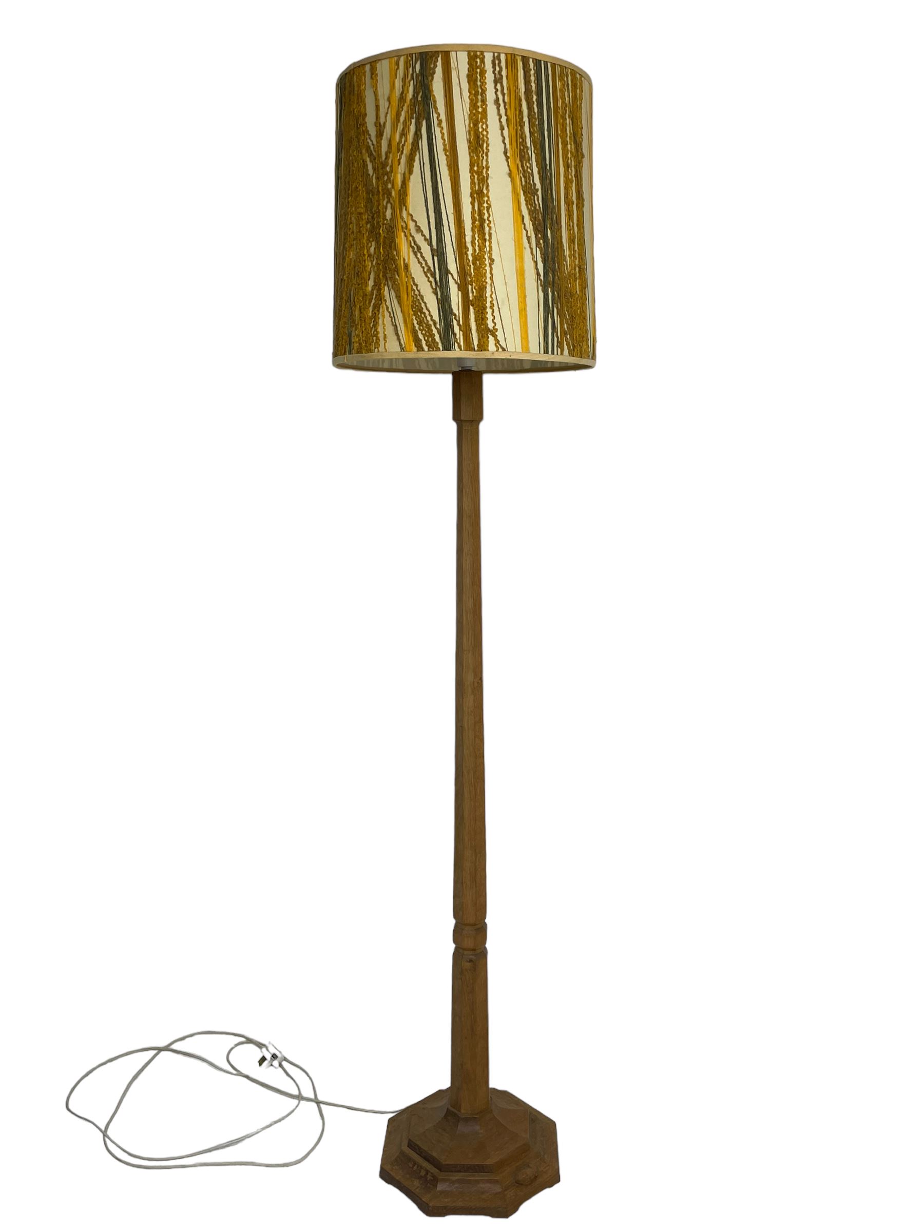 Mouseman - oak standard lamp, octagonal tapered column on octagonal base carved with mouse signature, by the workshop of Robert Thompson, Kilburn