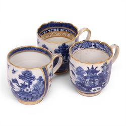 Five 18th century Qing Dynasty export coffee cups, all similar decoration in blue and white with gilt detail, together with two tea bowls  