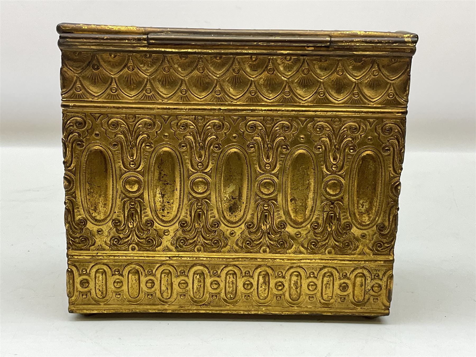 19th century brass repoussé perfume box, the ornately decorated casket with hinged domed cover lifting to reveal gold velvet lined interior containing three glass scent bottles, H14cm W15cm D7cm