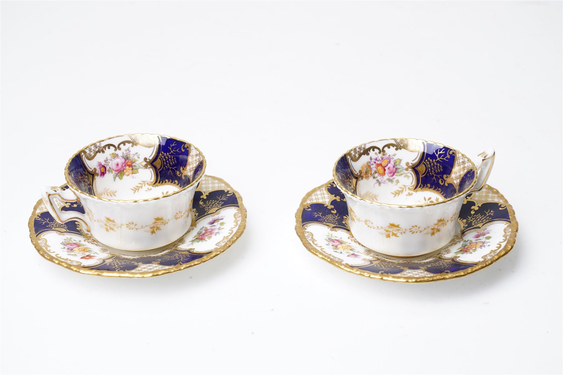 Grainger Lee & Co Worcester teacup, together with a collection of cobalt blue cabinet cups and saucers,  including a Royal Doulton hand-painted example by E Percy, and various others 19th century and later, mostly unmarked (7 pairs)