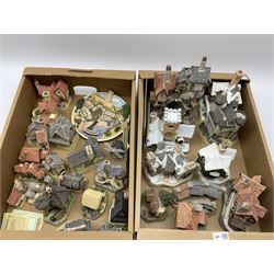 A collection of boxed David Winter cottages, of various size and form, to include Wreckers Cottage, Scottish Collection Macbeth's Castle, Special for Christmas 1988 Christmas in Scotland and Hogmanay, Special for Christmas 1990 Mister Fezziwig's Emporium, The Scrooge Family Home, Special for Christmas 1989 A Christmas Carol, The Midlands Collection Miners Row, Will-o-the wisp, etc., together with a plaque titled On the Riverbank, a number of examples with accompanying certificates. (30).