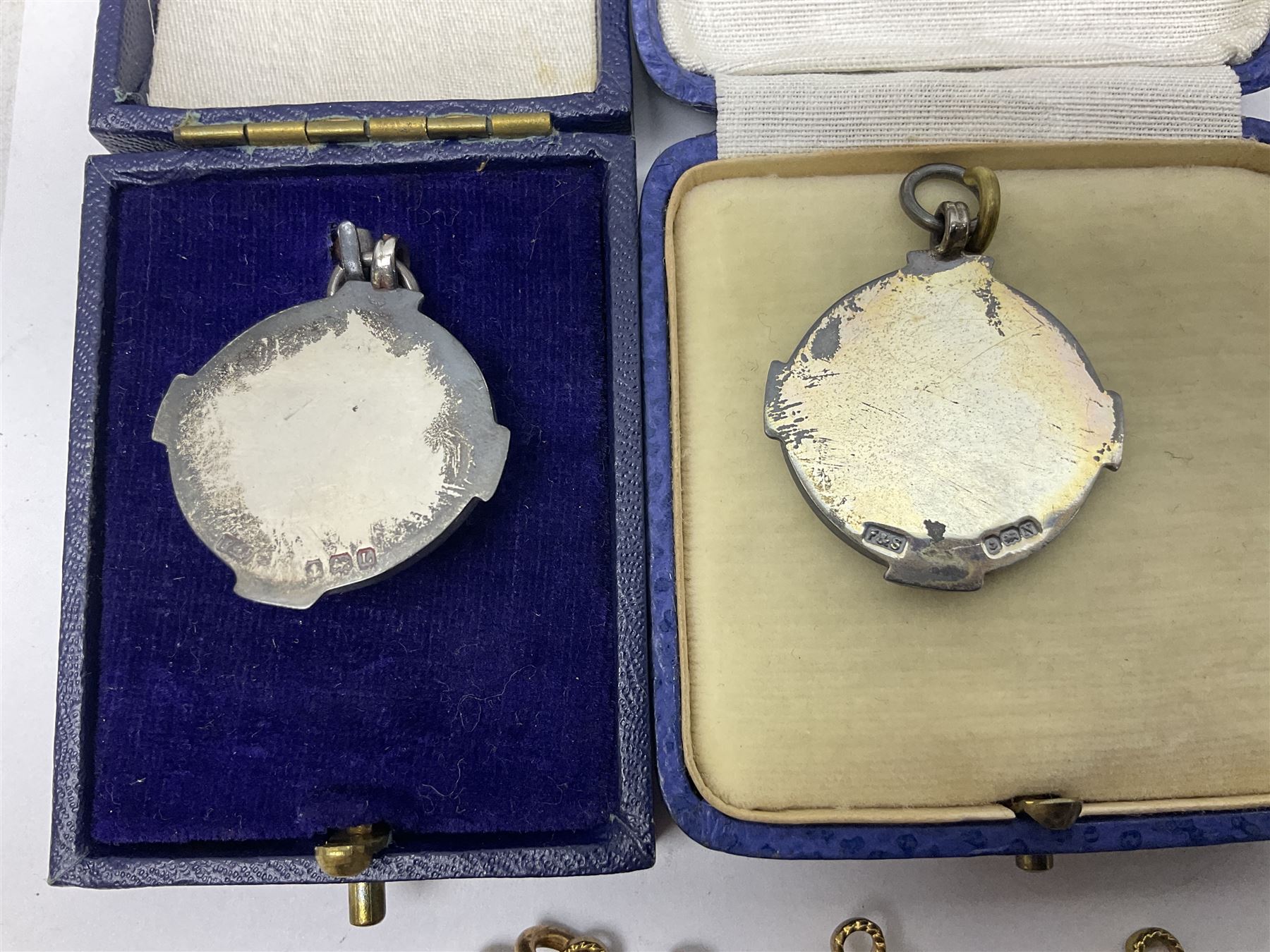 Four St John's silver fobs, together with two silver Directors Ambulance shield fobs and two other St Johns items 