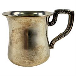 Silver sauce boat, hallmarked and a small silver christening mug, stamped sterling