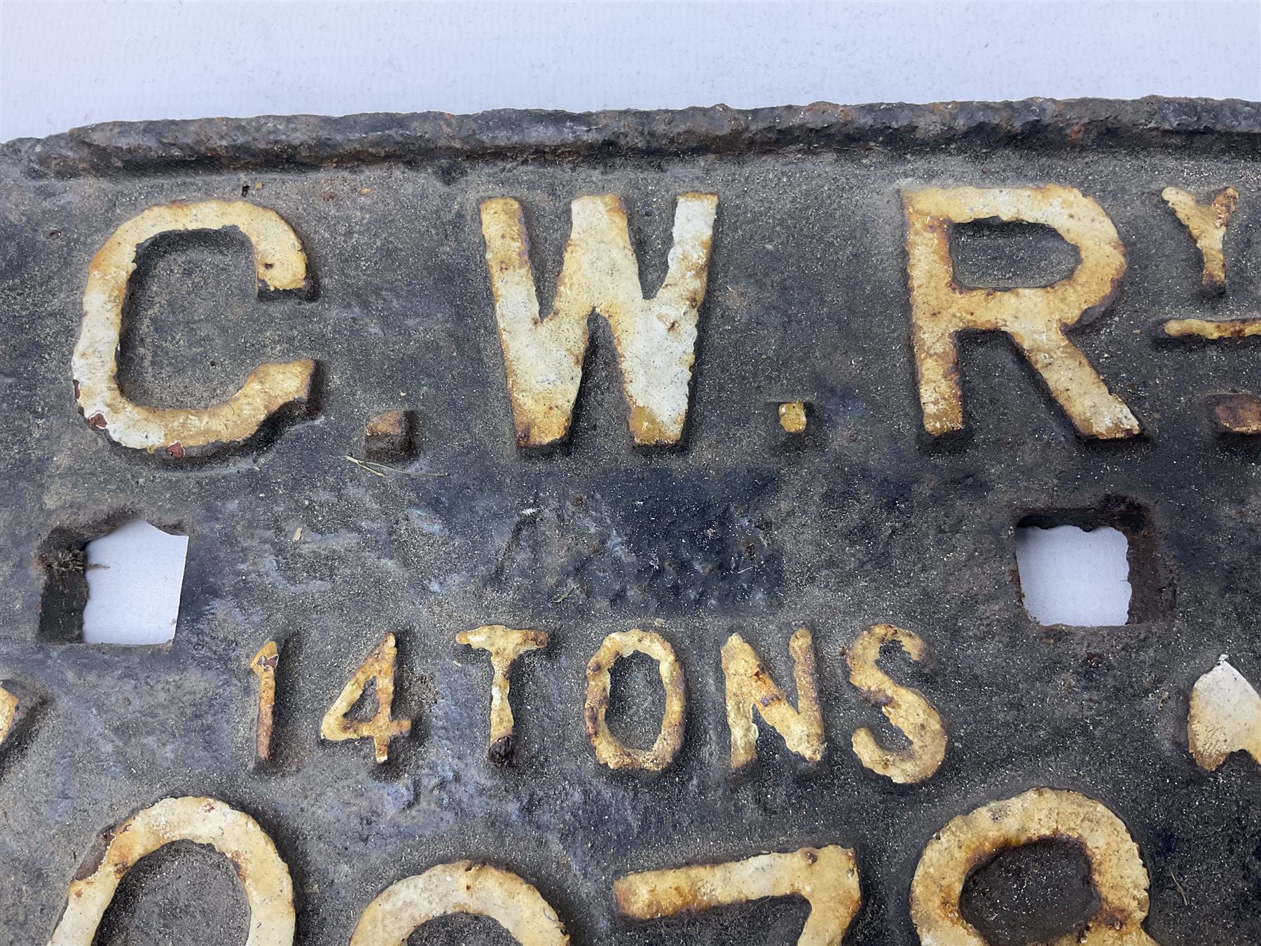 Three cast iron railway wagon plates of D shaped form to include Southern Railway, LMS and GWR, L27.5cm