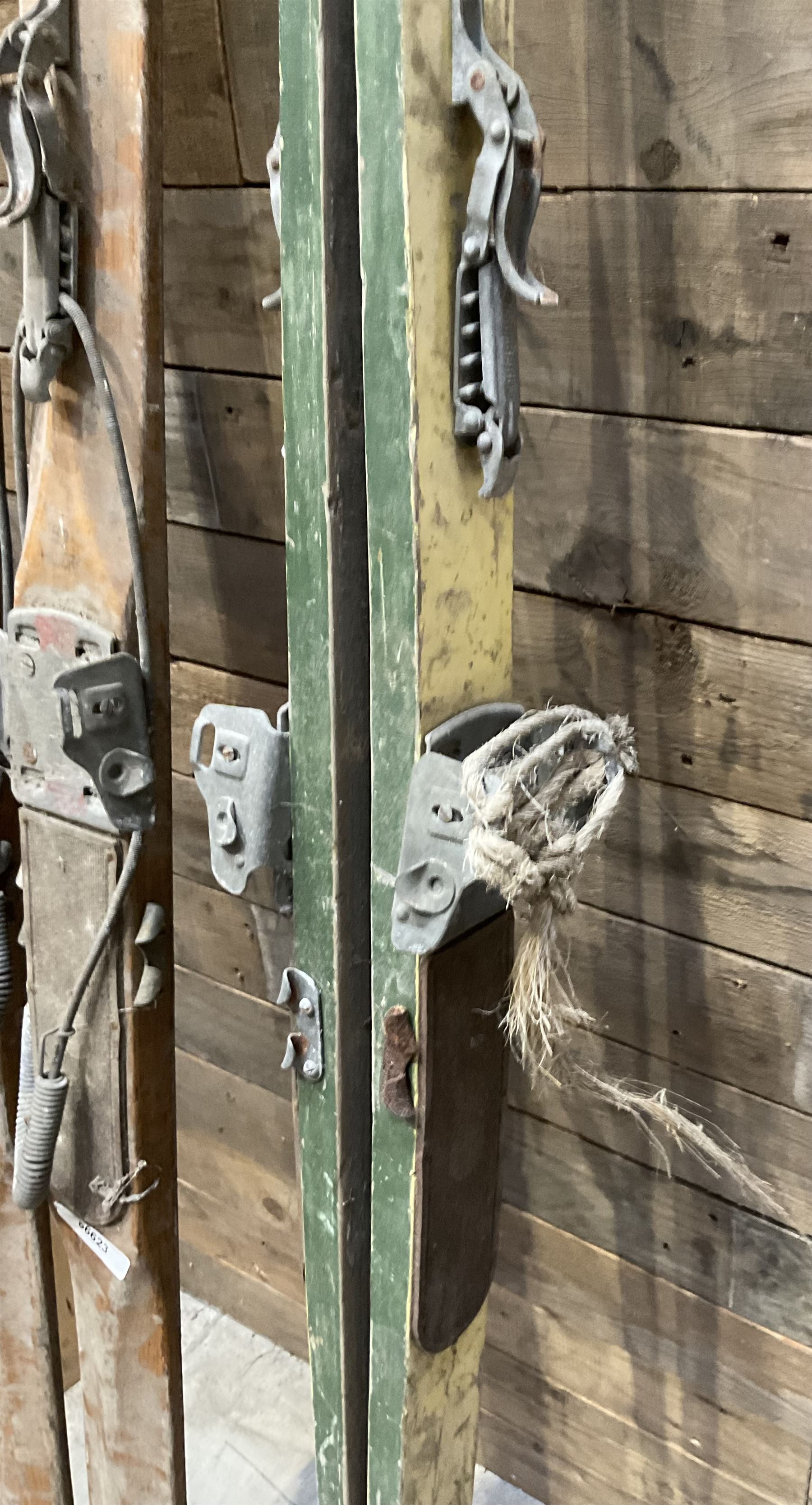 Two pairs of vintage skis, L207cm and 197cm