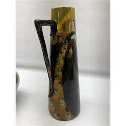 T. Forester Phoenix ware ewer of tapering form decorated with peacock and Bretby twin handled vase decorated with figures fishing in a boat sea scene