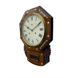 American - late 19th century 8-day mahogany drop dial wall clock, with a hexagonal dial bezel inlaid with mother of pearl, pendulum box with a rectangular viewing glass flanked by carved representations of grape vines, with a painted dial with roman numerals, minute track and steel spade hands within a spun brass bezel, eight day striking movement striking the hours on a gong.   With pendulum & key.