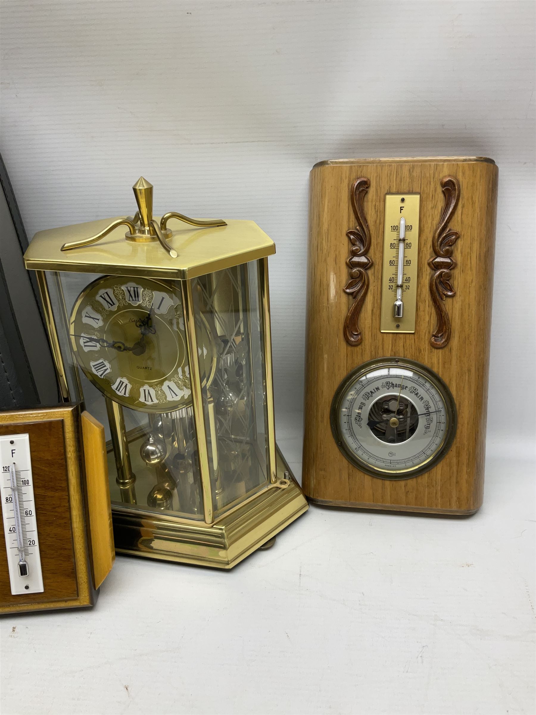 Kundo quartz clock, miniature brass clocks, two barometers, Sony digital camera, Nokia phone, Monarch Remington typewriter, commemorative Shilling etc