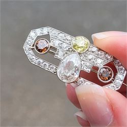 Early 20th century platinum diamond brooch, milgrain set with a pear cut faint brown diamond of approx 1.50 carat, an old cut fancy yellow / green diamond of approx 0.70 carat, and two old cut fancy orange / brown diamonds of approx 0.40 carat and 0.35 carat, surrounded by old cut white diamonds in an openwork setting, total white diamond weight approx 1.45 carat