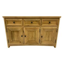 Solid light oak sideboard, fitted with three drawers and three cupboards