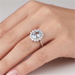 18ct white gold aquamarine and diamond cluster ring, single oval cut aquamarine of approx 2.80 carat, surrounded by fourteen round brilliant cut diamonds, hallmarked, total diamond weight approx 0.60 carat