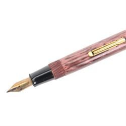 Watermans 512V fountain ped, in pink striated marble celluloid, lever filled, 14ct W-2-A nib with matching propelling pencil and a Conway Stewart No. 475 fountain pen, lever filled