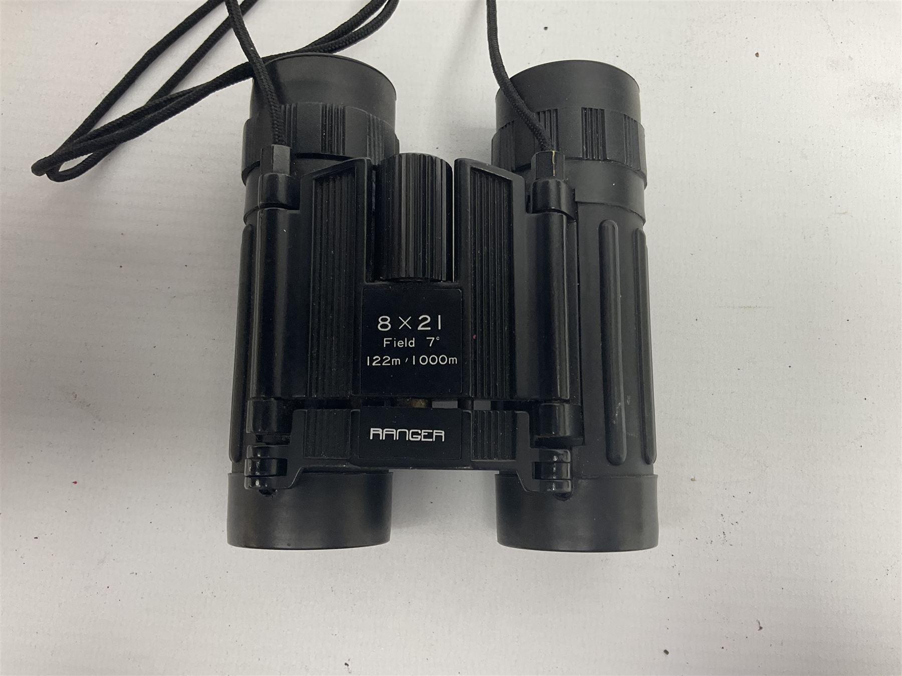 Pair of British World War Two issue black-painted binoculars, Bino 7x50 No. 5, 6E/320, No. 87412, MoD.B/42, with case, together with Nipole 10 x 50 binoculars and two other pairs