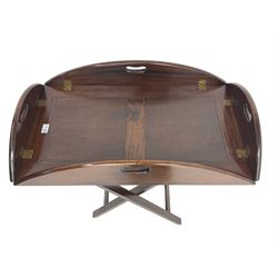 Early 20th century mahogany butler's tray, raised hinged sides with pierced handles, on folding x-frame base