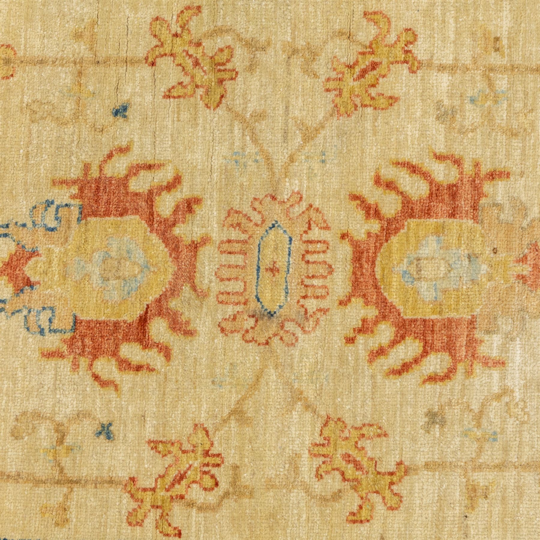 Cream ground prayer rug, with red and blue stylised motifs within a broad floral border, the field with central mihrab-style design in soft red, blue and beige tones