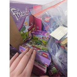 Lego Friends no. 3189 Stables set, Lego Trolls no. 41252 World Tour set, The Lego Movie set no. 70825, three small Lego Friends sets, all boxed and a quantity of loose Lego, including purple and pink colourways