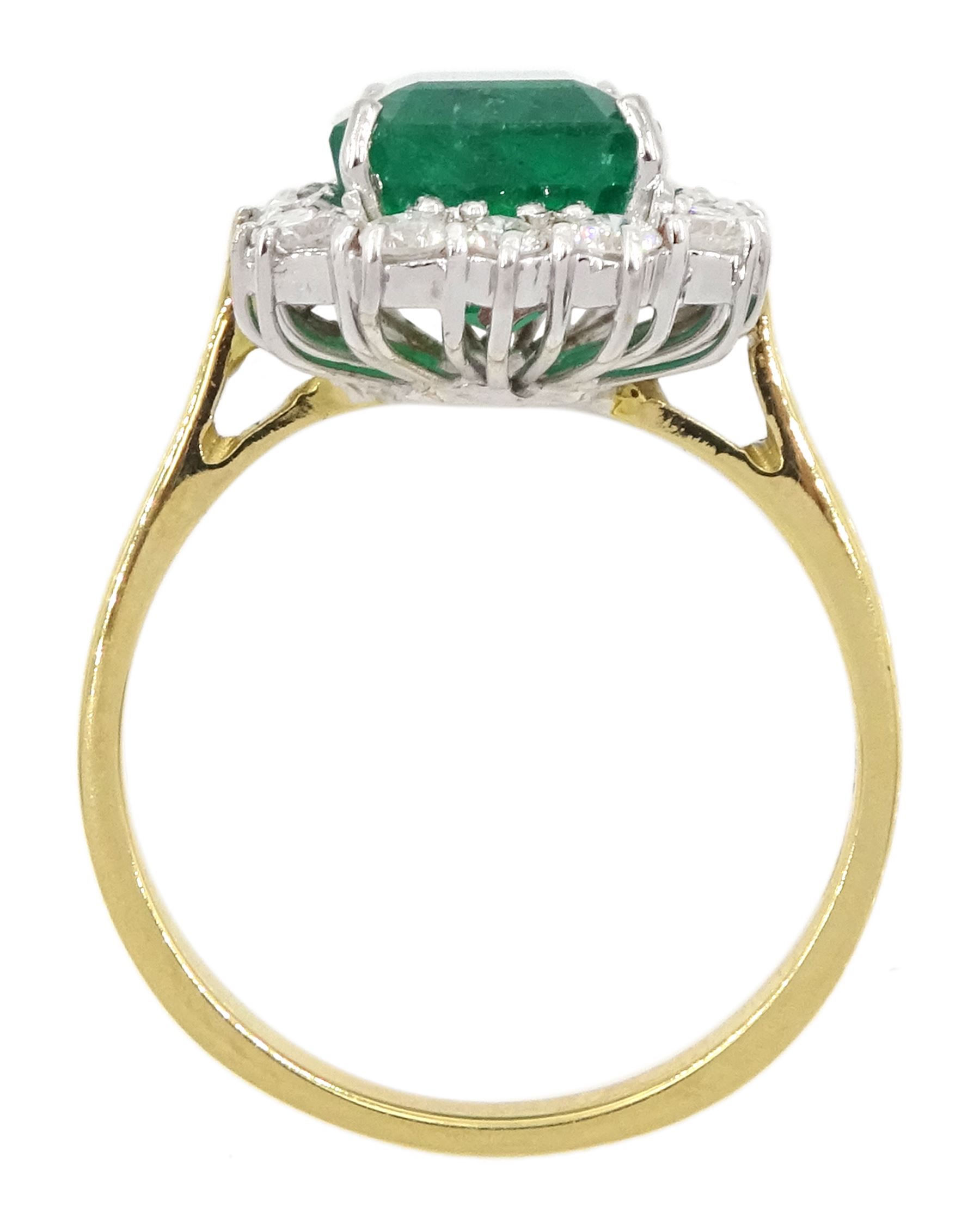 18ct gold emerald and diamond cluster ring, single octagonal cut emerald of approx 3.80 carat, with round brilliant cut diamond surround, hallmarked, total diamond weight approx 0.50 carat
