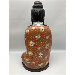 Tall Chinese polychrome figure of Guanyin (Guan Yin), the Goddess of Mercy and compassion, the Bodhisattva modelled seated and holding a rosary donning elaborate floral robes and beads, with four character seal marks beneath, H53cm