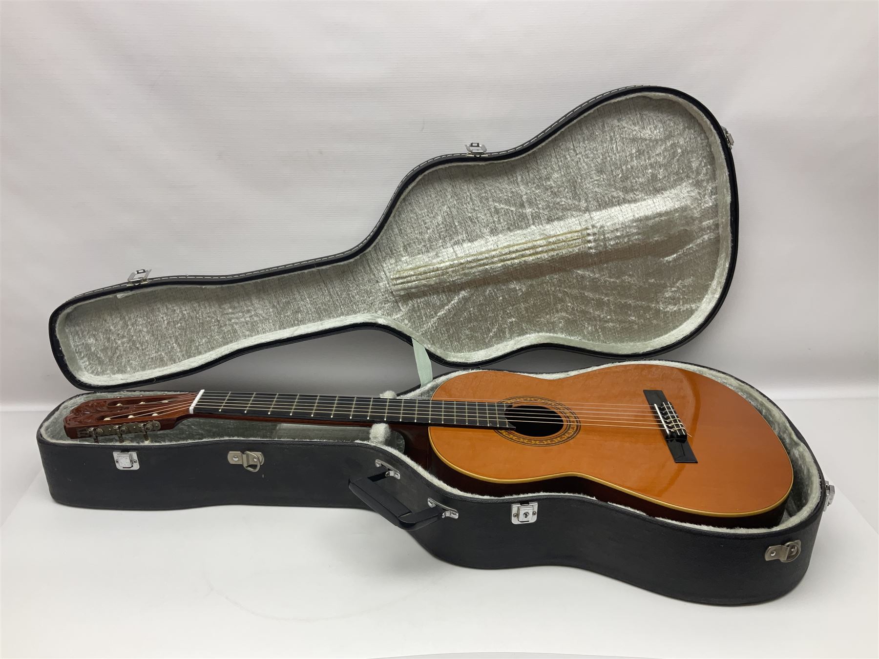 Harmony Model H6360 acoustic guitar in mahogany with spruce top, L103cm overall; and 1970s B&M (Barnes & Mullins) Concert Grande acoustic guitar, L101.5cm overall; each in hard carrying case (2)