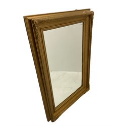 Rectangular mirror in gilt frame, decorated with cartouches and foliate