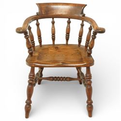 20th century captain’s oak smoker’s chair, with curved horseshoe back rail, turned spindle...