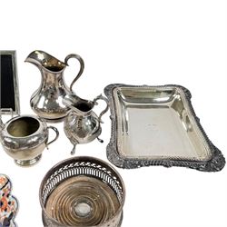 Silver plated items, including thee pairs of bottle coasters, sugar caster, Elkington jug, chamberstick etc and a Japanese Imari scalloped charger