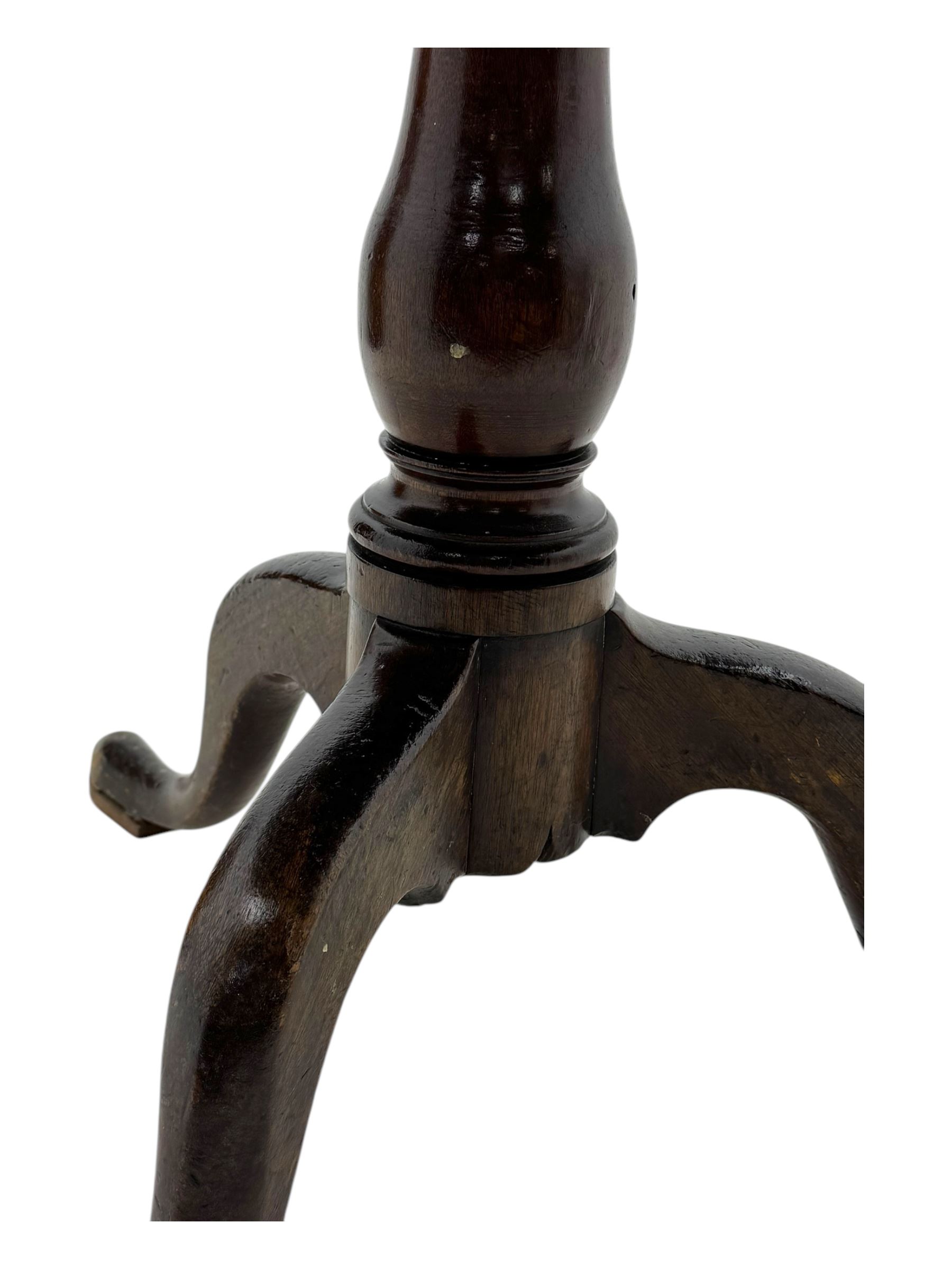 19th century mahogany tilt-top occasional table, circular top on a turned baluster column, raised on three splayed supports