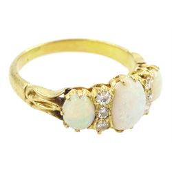 Early 20th century 15ct gold three stone opal and six stone old cut diamond ring