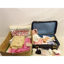  Quantity of table linen, lace trim, embroidered fabric and other haberdashery, bisque head doll with composite body, other dolls and dolls clothing in two boxes  