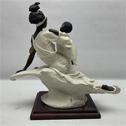 Giuseppe Armani Florence figure, Black Maternity, modelled as a mother and child upon a stylised cloud and mahogany base, H32cm