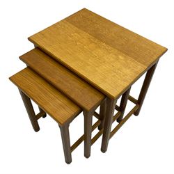 Acornman - oak nest of three tables, each with rectangular adzed tops and on chamfered supports, carved with acorn signature, by Alan Grainger, Brandsby, York
