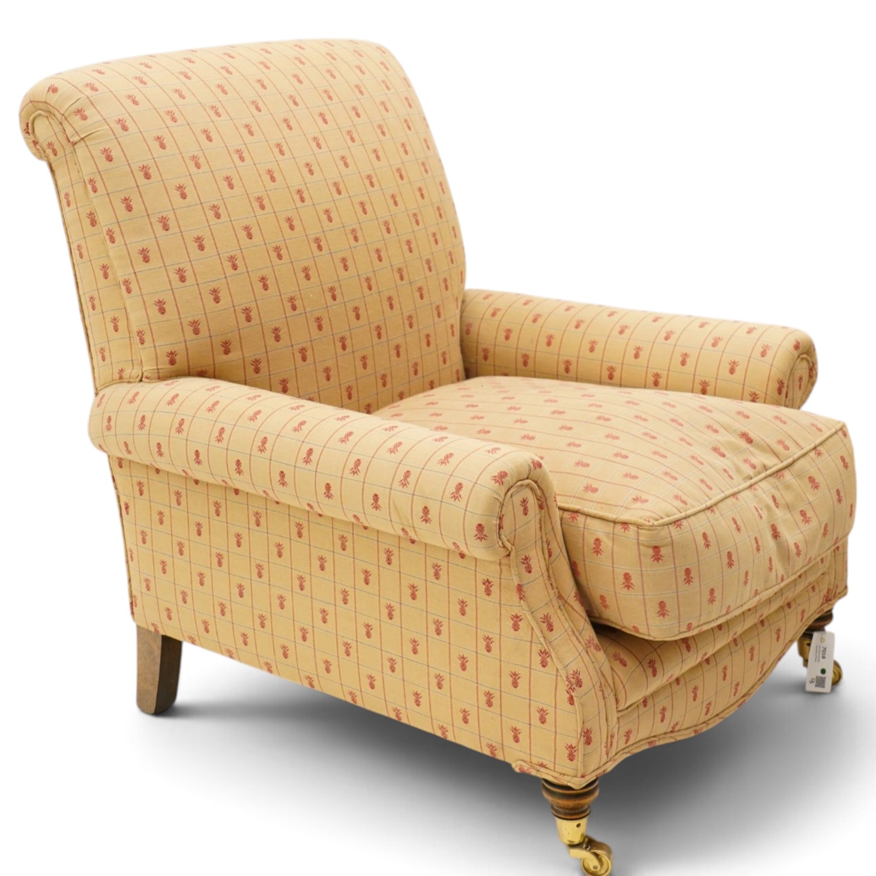 Pair of Victorian style armchairs of traditional shape, high rolled and sprung back over rolled arms, upholstered in chequered fabric with pineapple motifs with loose seat cushion, on turned feet with brass castors